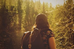 Solo female traveler in a forest