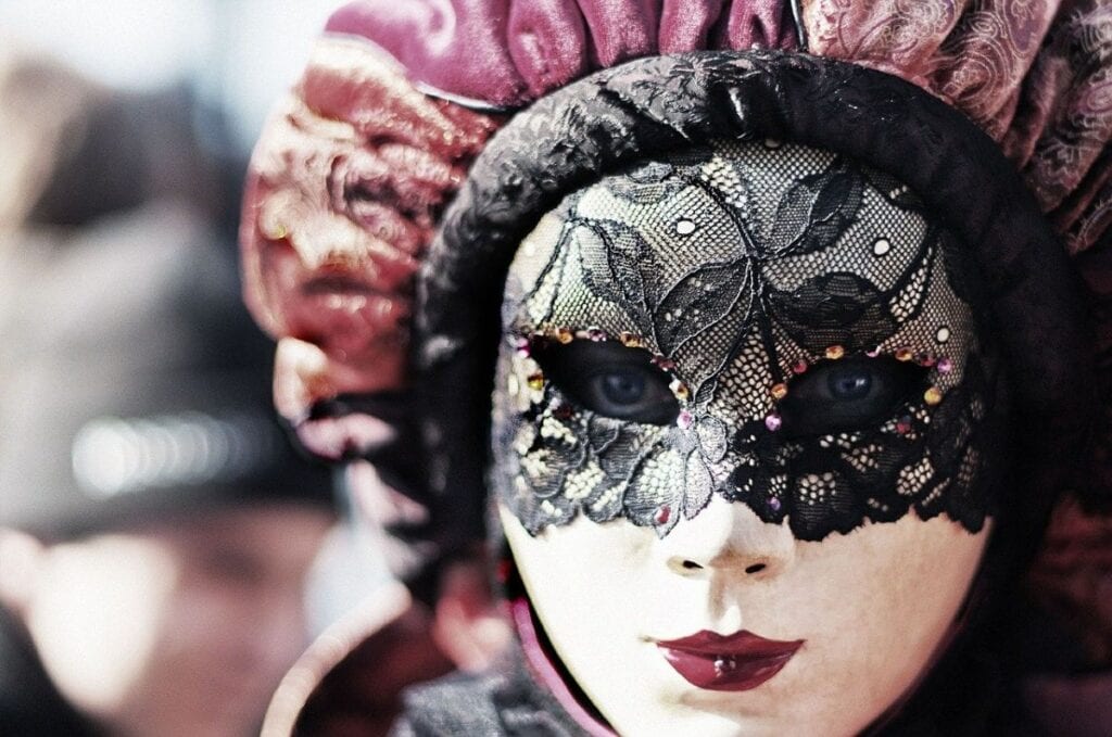 A Woman Wearing a Carnival Mask - An Authentic Souvenir from Venice