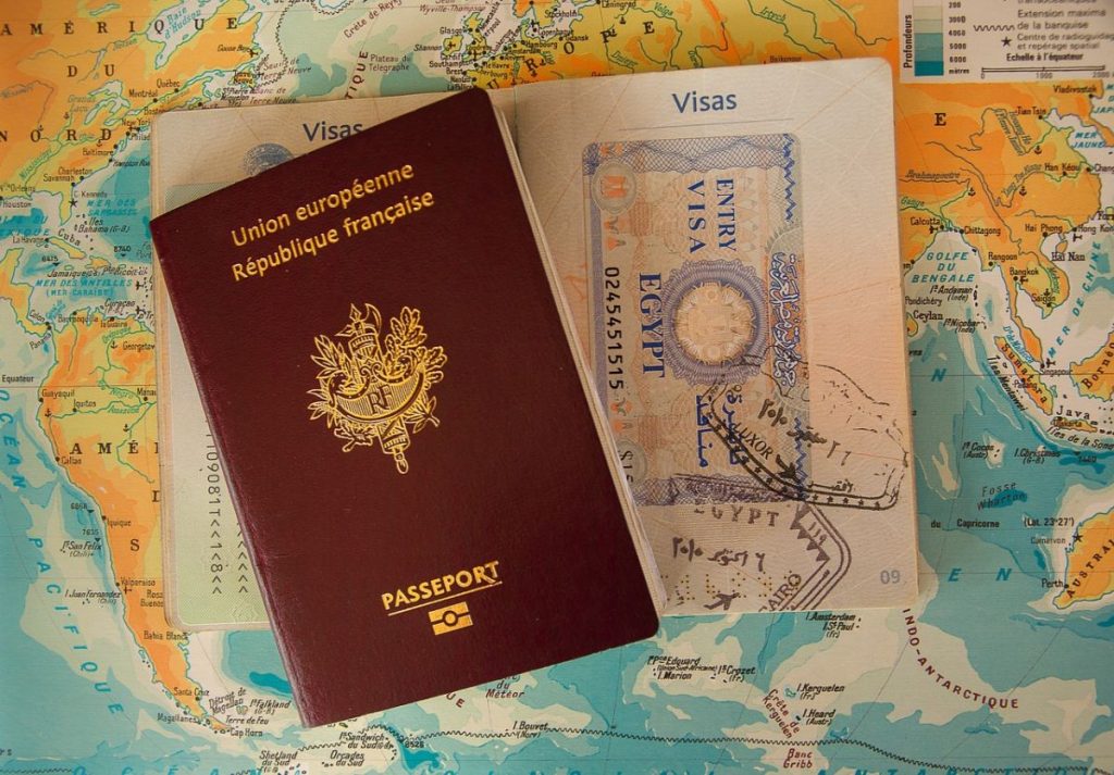 passport and visa page over a map
