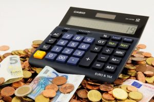 Calculator and money - Budget Travel Tips