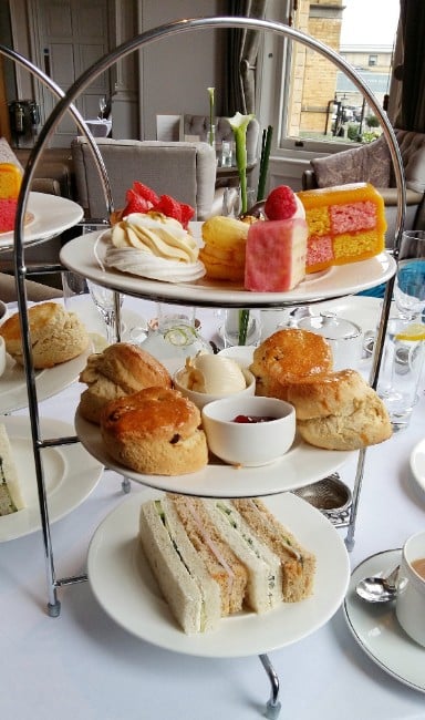 Afternoon Tea is always Beautifully Presented - Assortment of Cakes, scones and sandwiches on a 3 tier stand