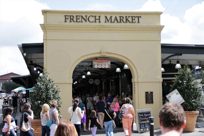 The archway entrance of New Orleans French Market - That Texas Couple