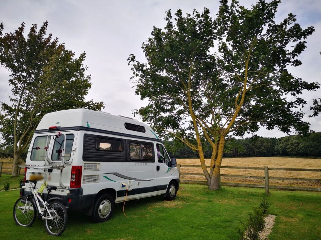 Mabel the Motorhome at a Campsite - campervan Accessories for a Fab Campervan Road Trip