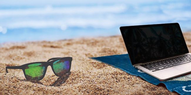 Laptop on a Beach - Working Abroad has its Perks