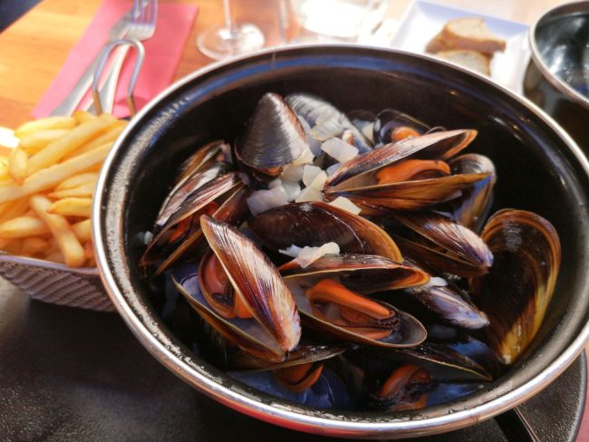 Simple and Classic Moules Frites from France - A Bowl of steamed mussels with french fries