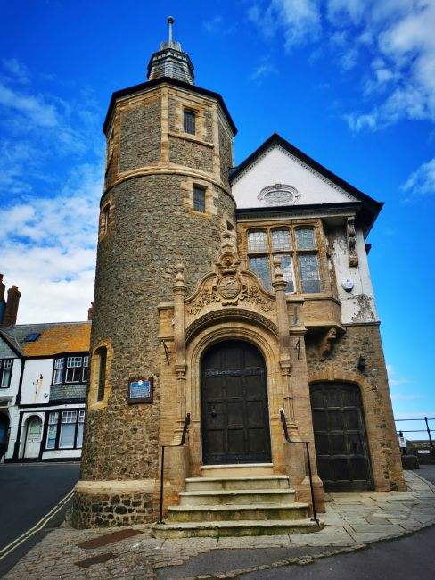 Lyme Regis Guildhall historical building, with a stone tower