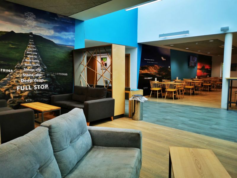 Lounge Area with Artwork on the Wall of a photo of Hadrian's Wall with a poem written on it