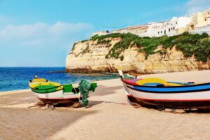 Portuguese Carvoeiro Beach with classic fishing boats - Free Things to do in Algarve