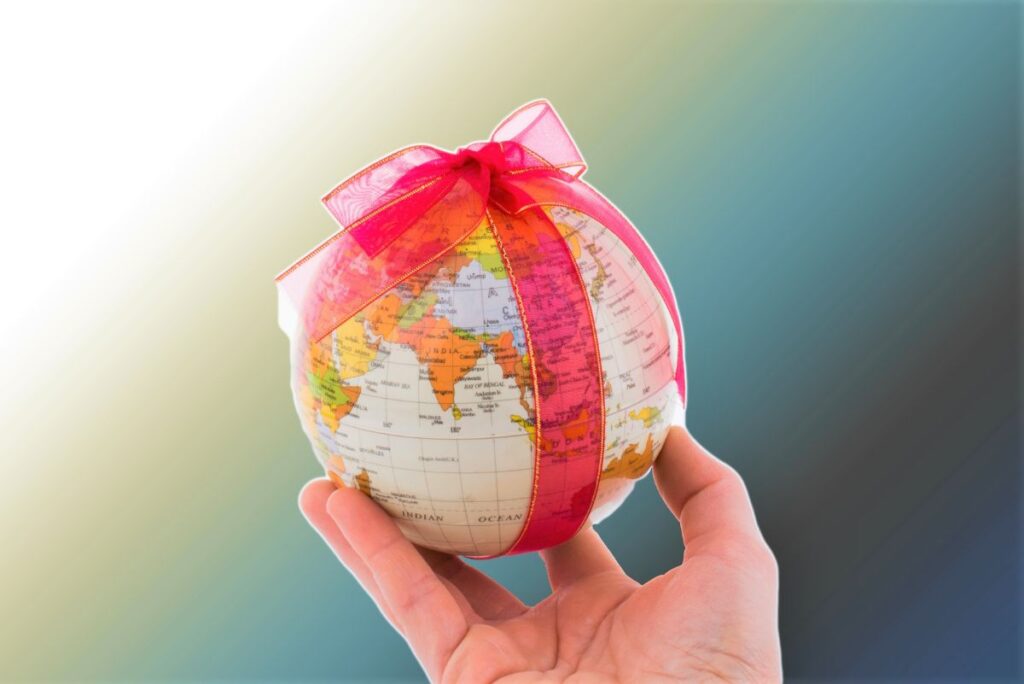 Globe Wrapped in a Bow - The Best Travel Gifts for Travel Lovers