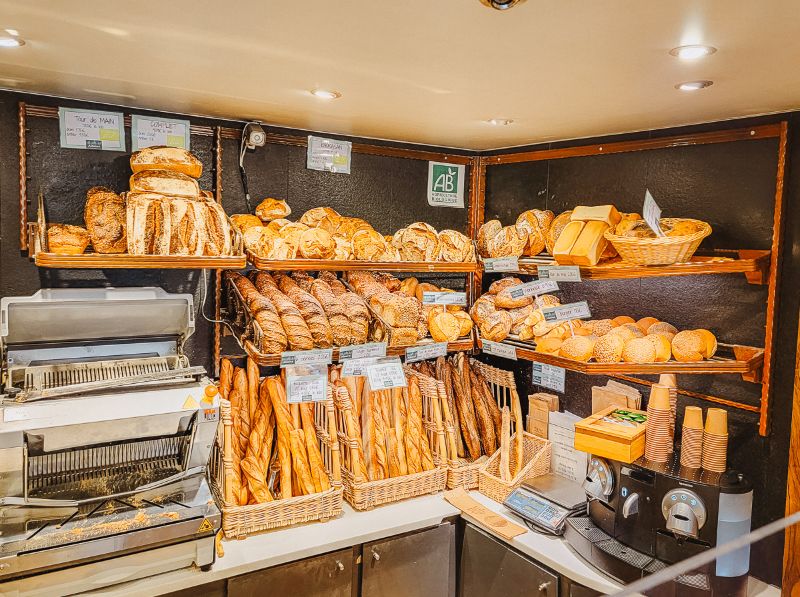 Shelves filled with French bread and Baguettes in A Boulangerie in Paris