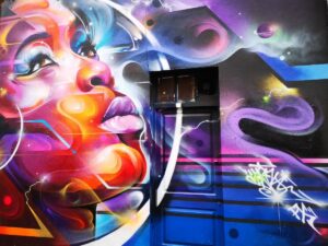 A Beautiful Street Art Mural on Brick Lane - How to Visit London on a Budget
