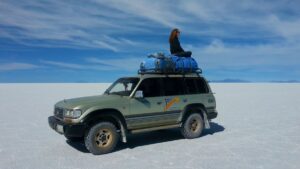 Sitting Alone on top of a Land Cruiser in the Salt Flats of Bolivia - the Disadvantages of Solo Travel