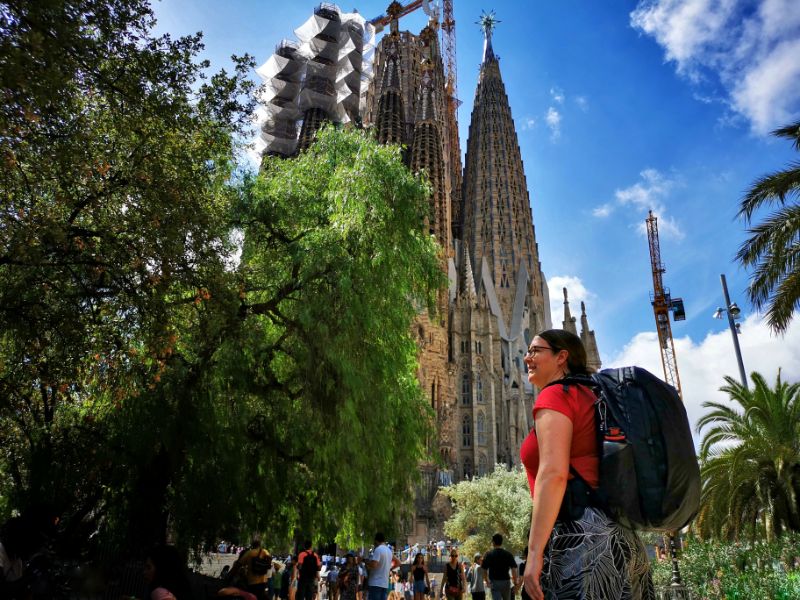 Me Wearing the Tortuga Travel Backpack in Barcelona with the Sagrada Familia in the Background - Tortuga Travel Backpack Review