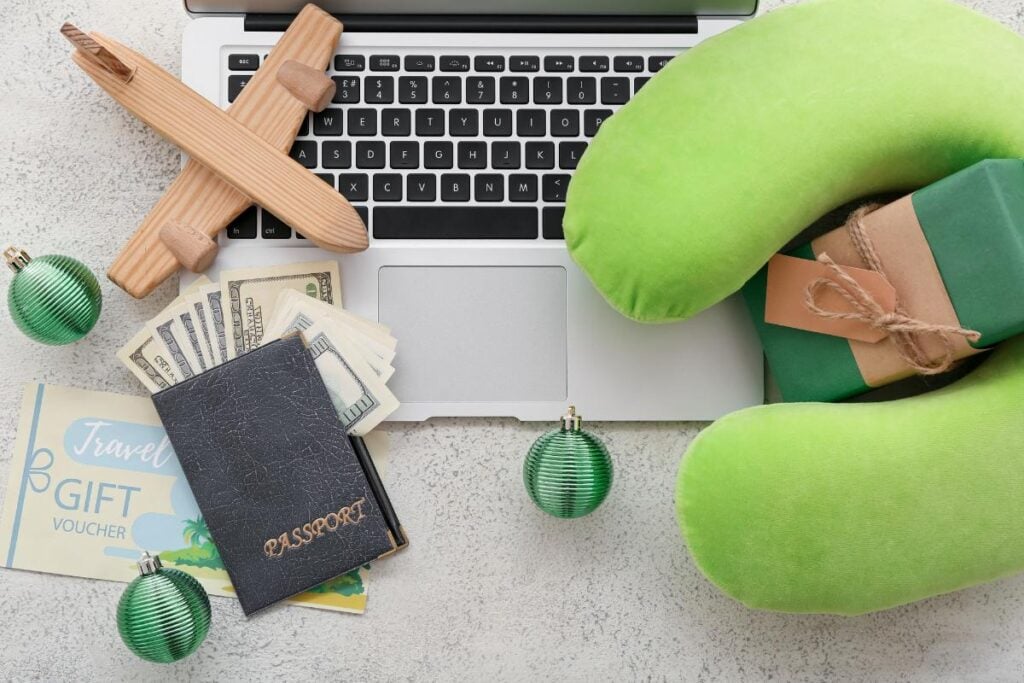 Laptop with Travel Accessories and Christmas Decorations