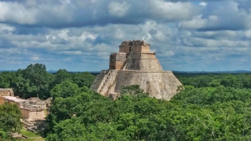 Mayan Ruins at Uxmal - a stone pyramid rising up out of the forest. A 2 Week Yucatan Itinerary