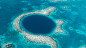 The Great Blue Hole in Belize dark blue circle in a turquoise sea